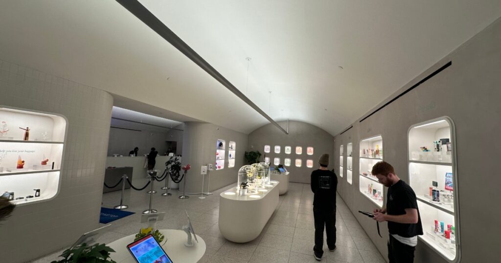 Knowledgeable staff helping visitors inside a modern New York City dispensary