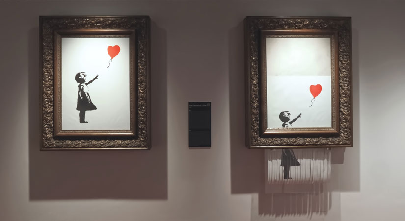 Framed artwork of a girl reaching for a red balloon displayed in a gallery